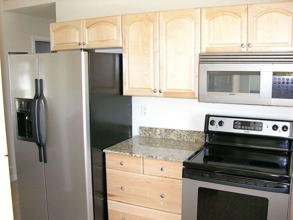 Stainless Steel appliances, Solid wood cabinets, and Granite Counters everywhere