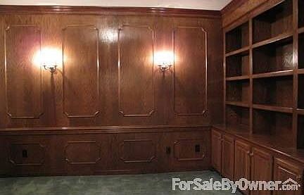 Study
						:
						Solid oak cabinets, bookshelves and wall paneling. Beautiful Italian sconces.