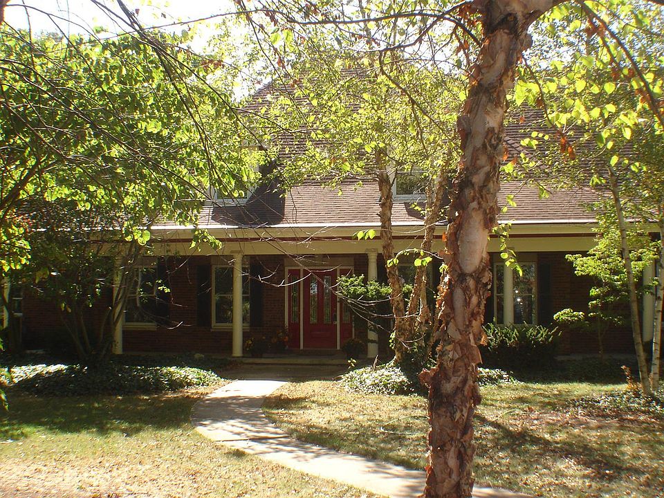 Front entrance with a curved sidewalk