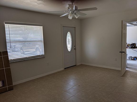 Living room and doorway into garage.
