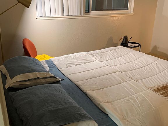 Spacious bedroom with queen bed (included).
