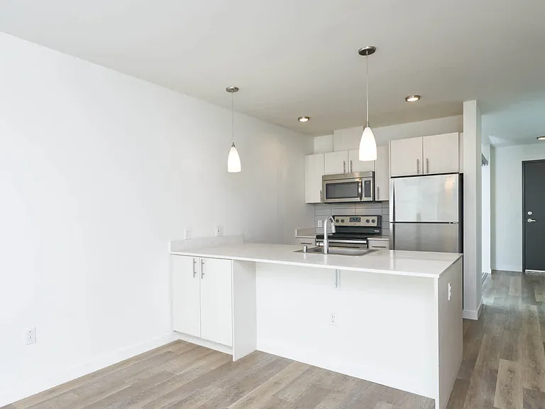 Kitchen with Breakfast Bar and Stainless Steel Appliances
