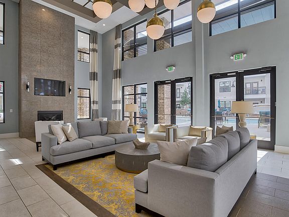 Lounge area, TVs and fire place in Entertainment Lounge