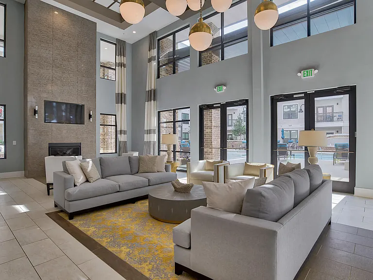 Lounge area, TVs and fire place in Entertainment Lounge