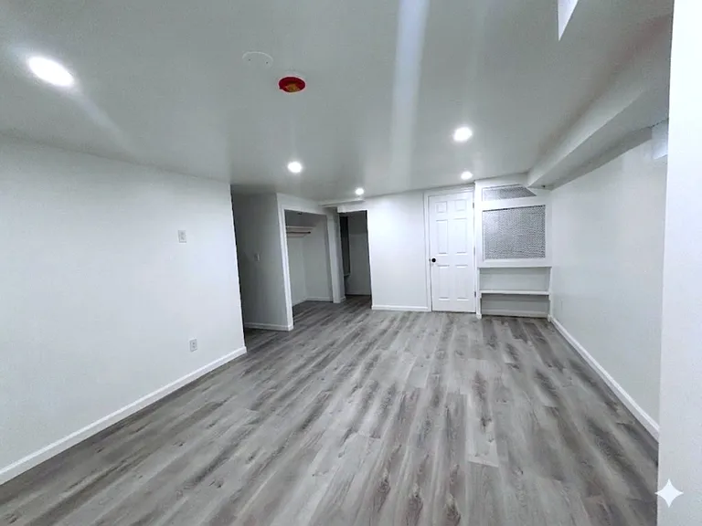Completely renovated bonus room with private shower and access to house and garage. Plenty of storage space.