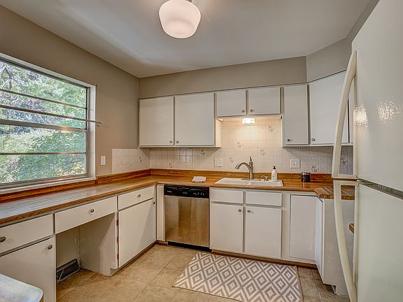 Large kitchen with window to backyard
