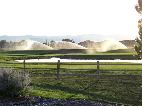 Morning view across HOA maintained pond and playground & pit