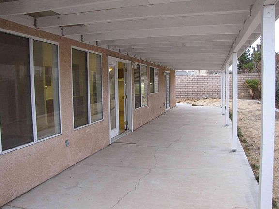 Both the kitchen and family room look over the back patio so