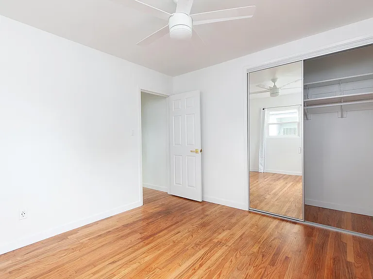 Front bedroom. Both bedrooms have fans with ceiling lights.