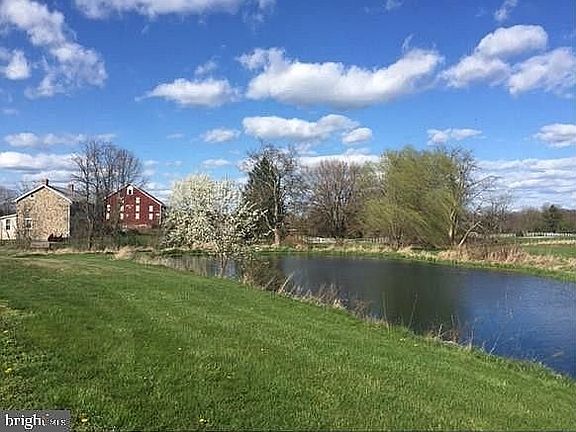 Fish pond behind farmhouse.