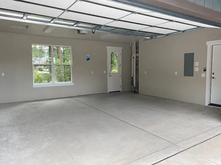 Large two car garage. It has shelving and basic tools for your use.