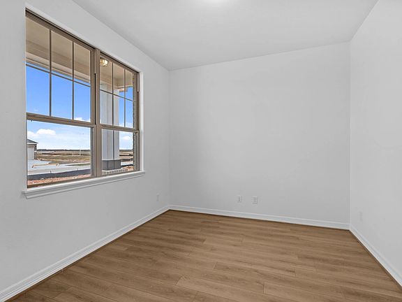 A light-filled study offering a peaceful space for work or reflection, grounded in natural textures.