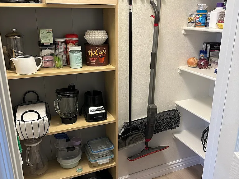 Walk-in pantry with kitchen appliances, vacuum