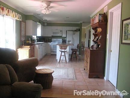 Eat-In or Country Kitchen area : Add a table or rrom for sofa/chairs. Door leads to laundry room, th