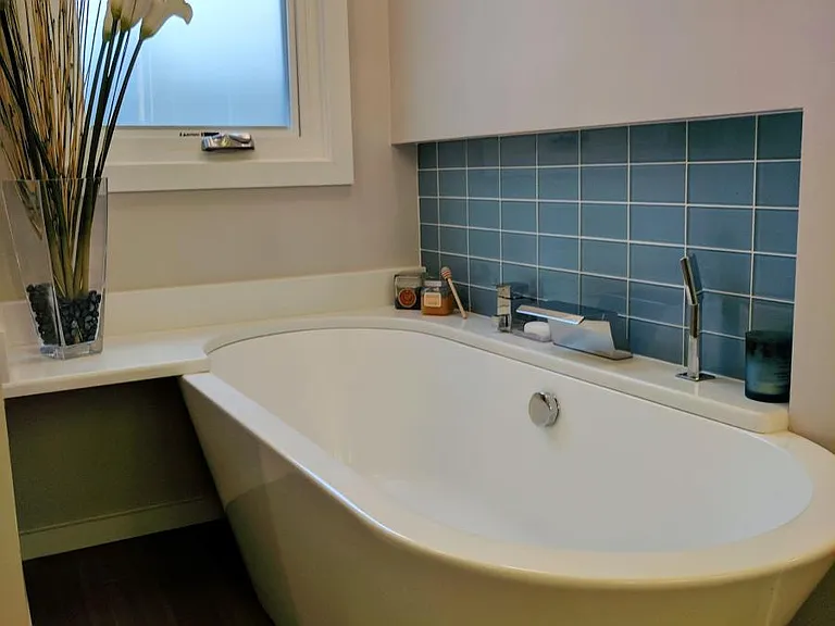 Master Bath: Stand-alone tub, casement window