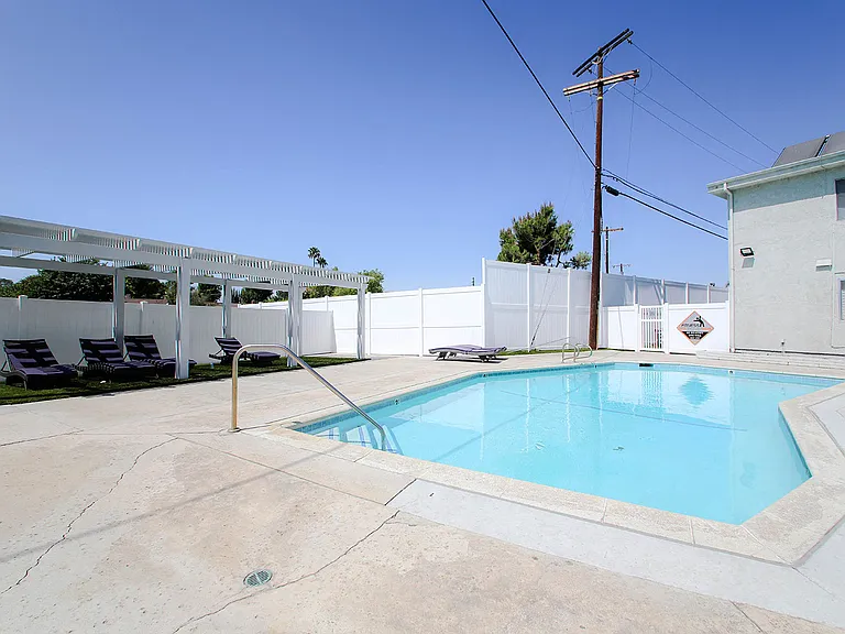 Gated pool with lounging area at Cedar Glen.