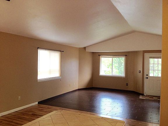 Living room with vaulted ceiling and lots of light