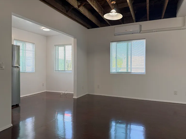 Abundant windows allow natural light and breeze into the unit.