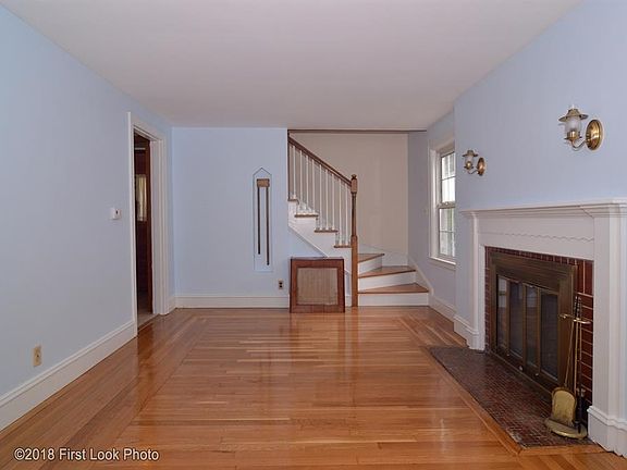 Another view of the fireplaced living room.