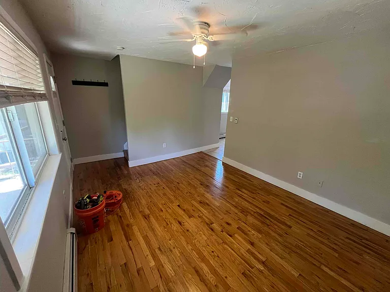 Living room with stairs leading to bedrooms