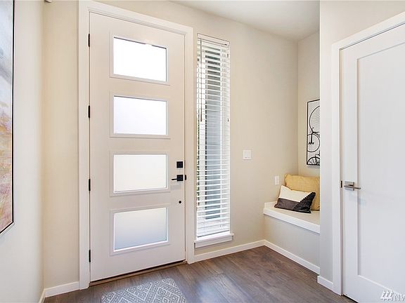 Entry w/boot bench & coat closet.  Photos of another 2273 at another Harbour Homes community. Details and color selections will vary.