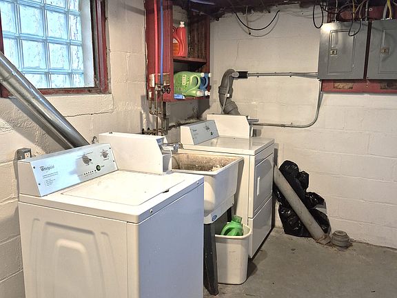Laundry units in basement for use.