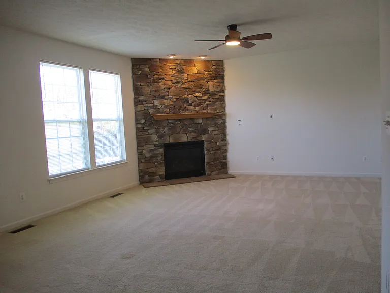 Large Family Room with Stone Natural Gas Fireplace