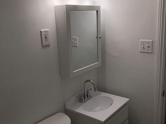 View from inside bathroom. Mirror is different than pictured