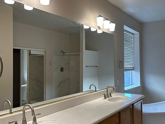 Master bath with brand new fixtures (faucets, showers and lights)