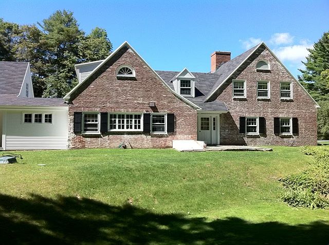 Approach to front of house in spring.