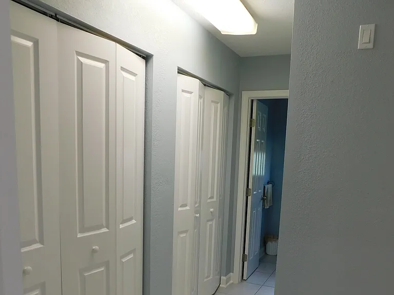Exiting through the west doorway of the dining room, you enter the kitchen nook. Just to the right is the hallway leading to the half bath. The garage entry door is just to the right. The double bi-fold doors on the left are for the washer & dryer.