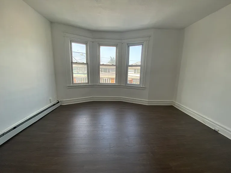 Bedroom 3 (primary with bay window)