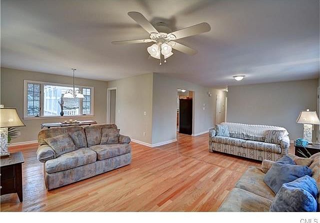 Living room overlooking dining room, rear deck, and kitchen.
