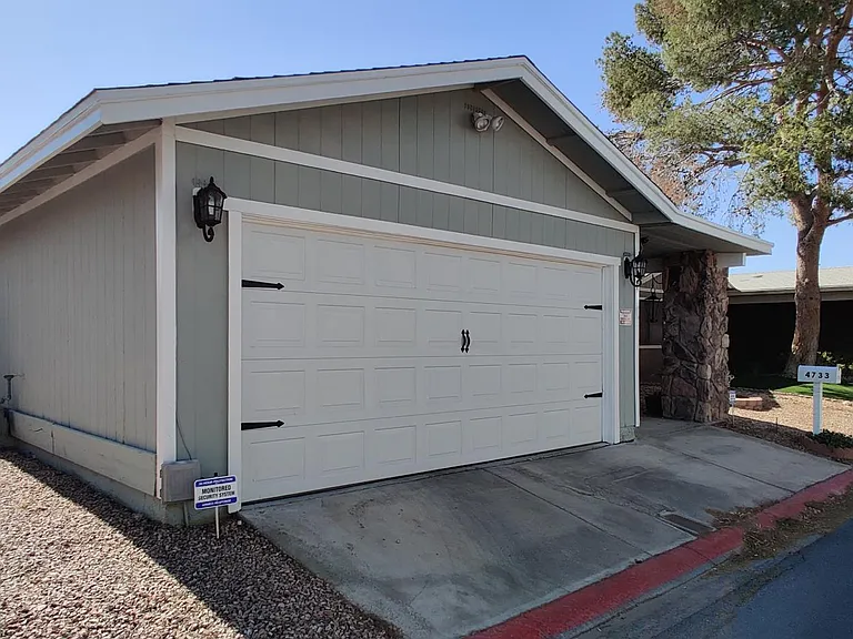 Extra parking on the side of home and RV parking behind the gate in the backyard.