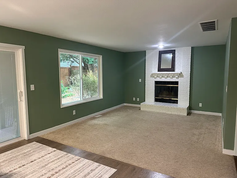 Family room with a sliding door to the backyard