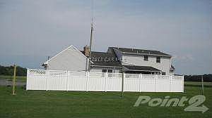 The fenced in area has an inground pool.