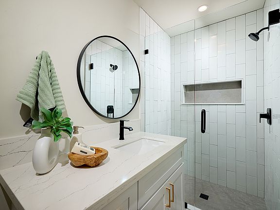 New tile subway shower and plumbing! All new fixtures, tankless hot water heater, quartz vanity .