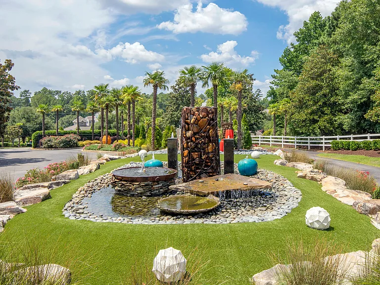 Immerse yourself in the tranquil beauty of our feature fountain, where elegance and grandeur meet.