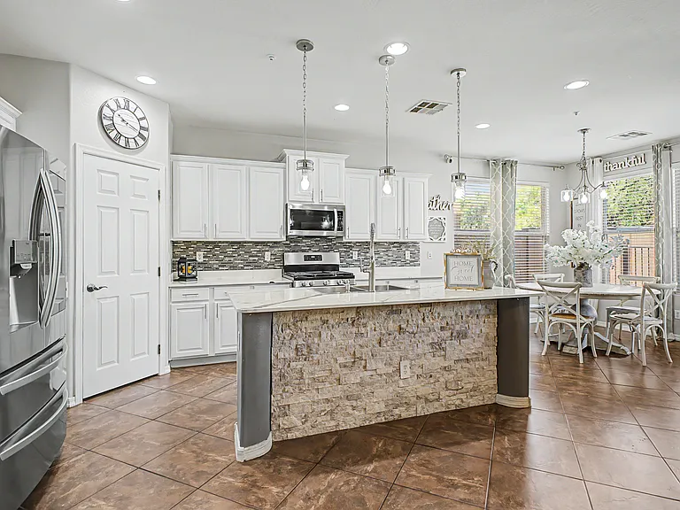 Kitchen counters are currently epoxy with original granite underneath.