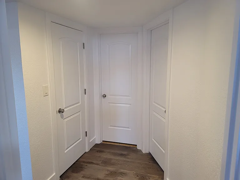 Hallway to bathroom bedroom and closet