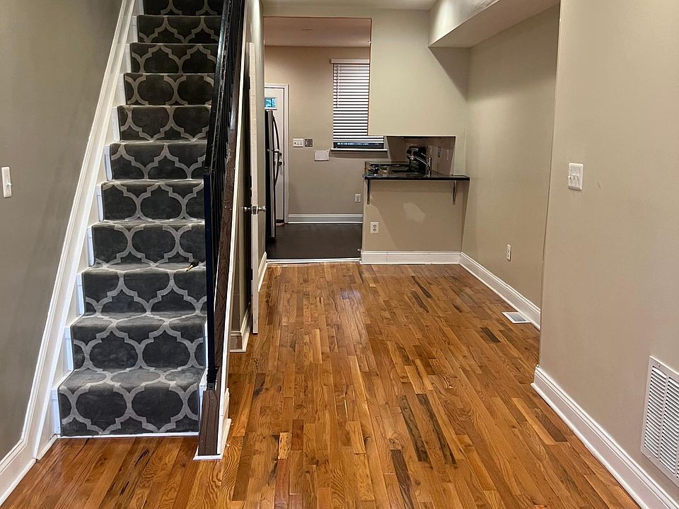 Entry area, living room and adjoining dining area