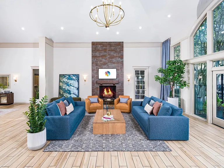 Warm finishes, cozy seating, and a fireplace focal point create a welcoming space to connect or unwind.