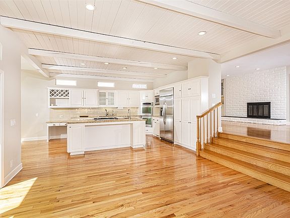 The very nice size eat in kitchen has been beautifully remodeled. The sunset views can be enjoyed from the kitchen as well as the family room, the upstairs bedrooms and it has a view deck above the 2nd level..