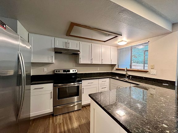 Kitchen with view of private backyard