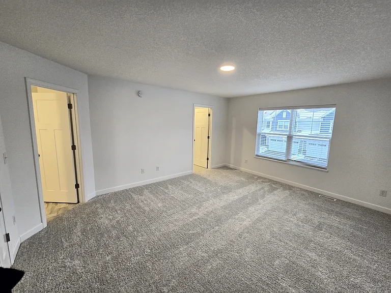 Master Bedroom with seperated walk-in closet and bathroom.