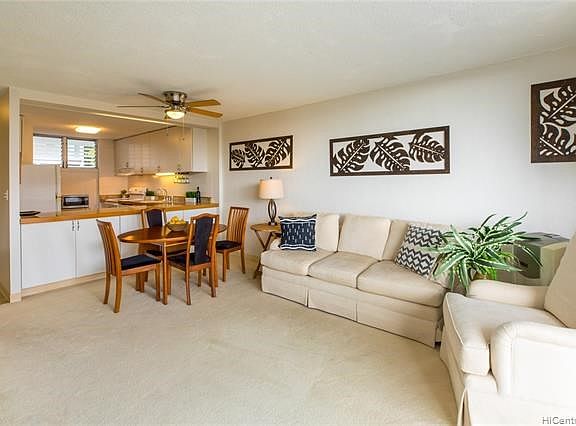 Enjoy entertaining in this open floor plan.  Below the counter are two large shelves for more storage area's that are accessible from the dining area.