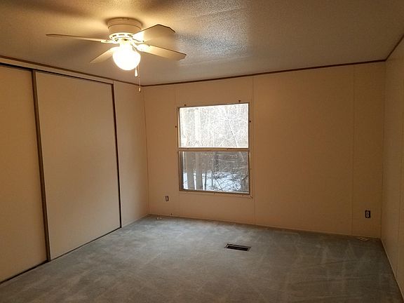 Primary bedroom with large closet, ceiling fan