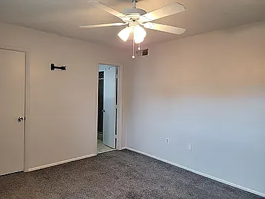 Master bedroom with TV mount and Ceiling fan