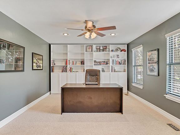 Spacious main floor office with bookcases