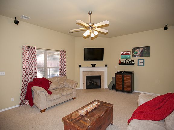 Carpeted living with fireplace